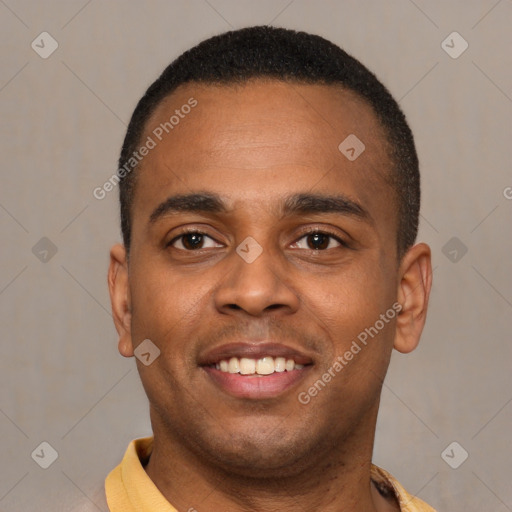 Joyful latino young-adult male with short  brown hair and brown eyes