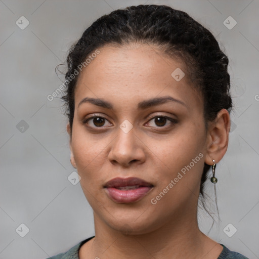 Joyful latino young-adult female with short  brown hair and brown eyes