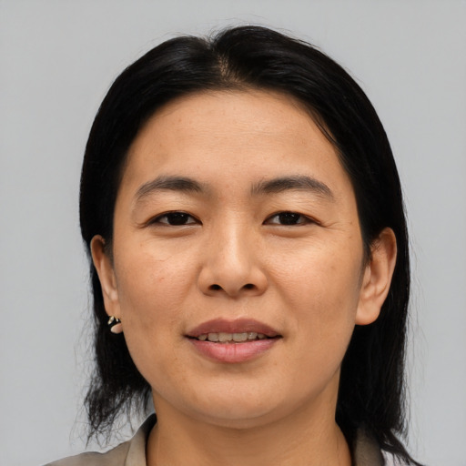 Joyful asian young-adult female with medium  black hair and brown eyes