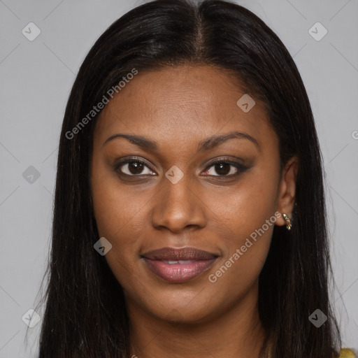 Joyful black young-adult female with long  brown hair and brown eyes