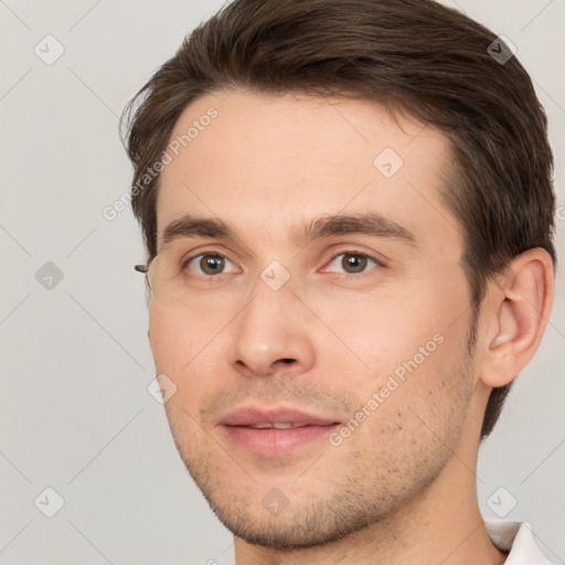 Neutral white young-adult male with short  brown hair and brown eyes