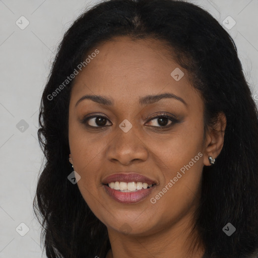 Joyful black young-adult female with long  brown hair and brown eyes