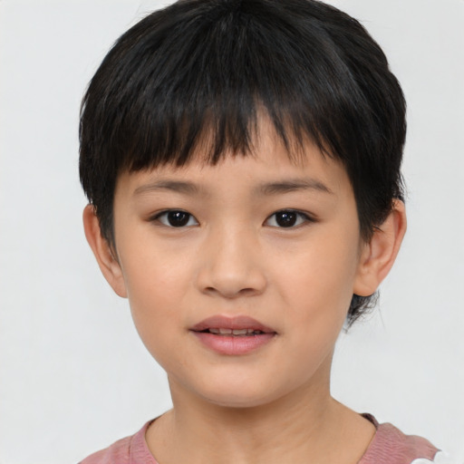 Joyful asian child female with short  brown hair and brown eyes