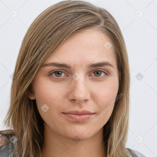 Neutral white young-adult female with long  brown hair and brown eyes