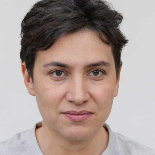 Joyful white adult female with short  brown hair and brown eyes