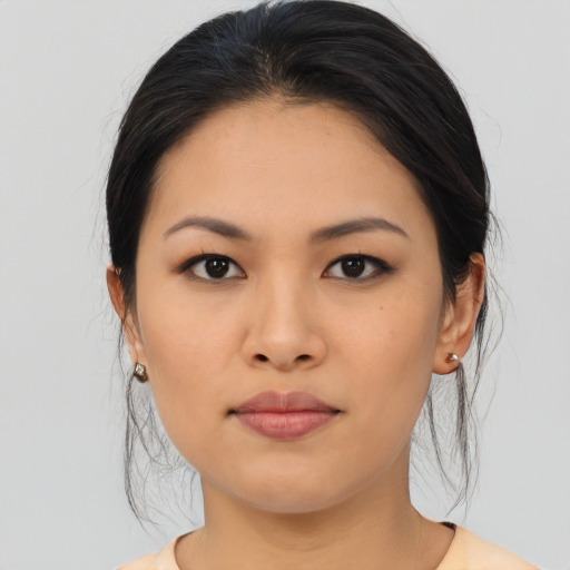 Joyful asian young-adult female with medium  brown hair and brown eyes