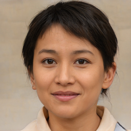 Joyful asian young-adult female with medium  brown hair and brown eyes