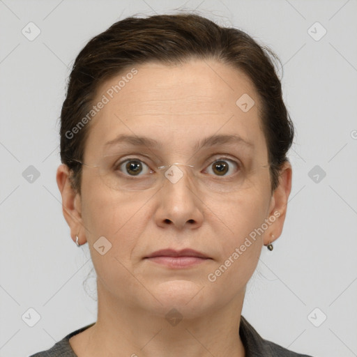 Joyful white adult female with short  brown hair and grey eyes