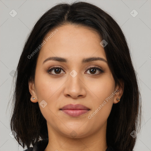 Joyful latino young-adult female with long  brown hair and brown eyes