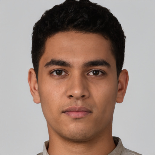 Neutral latino young-adult male with short  black hair and brown eyes
