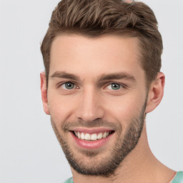 Joyful white young-adult male with short  brown hair and brown eyes