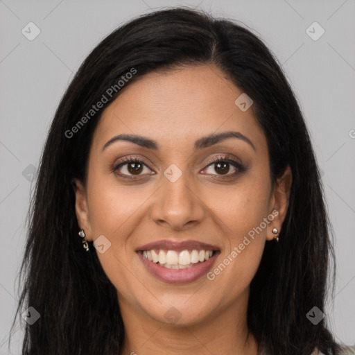 Joyful latino young-adult female with long  brown hair and brown eyes