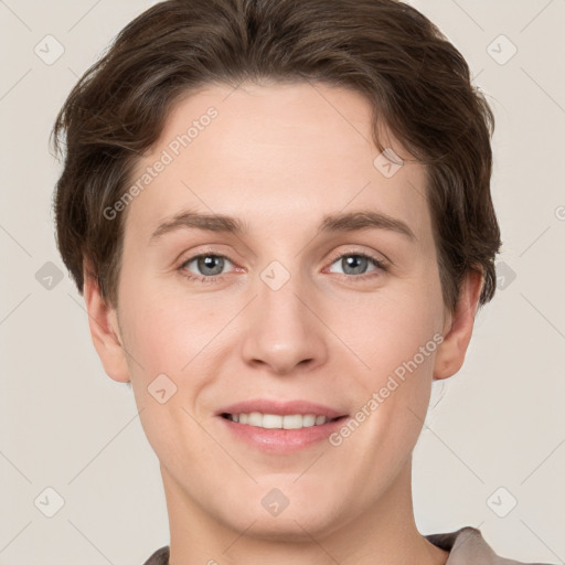 Joyful white young-adult female with short  brown hair and grey eyes