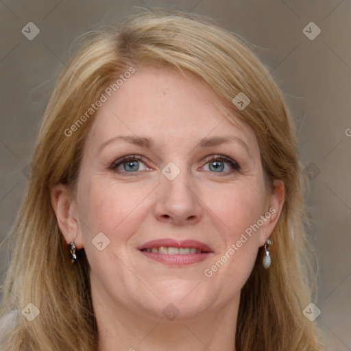 Joyful white adult female with long  brown hair and grey eyes