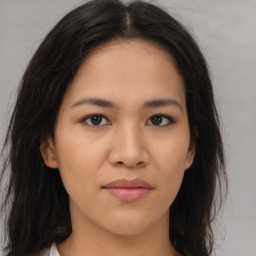 Joyful asian young-adult female with long  brown hair and brown eyes