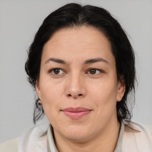 Joyful asian adult female with medium  brown hair and brown eyes