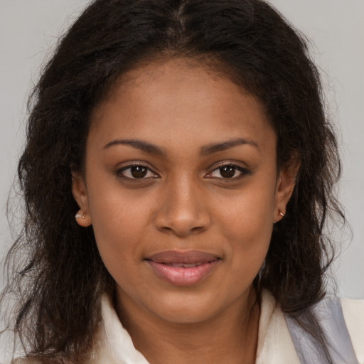 Joyful black young-adult female with medium  brown hair and brown eyes