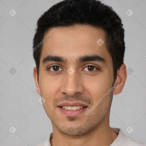 Joyful white young-adult male with short  black hair and brown eyes