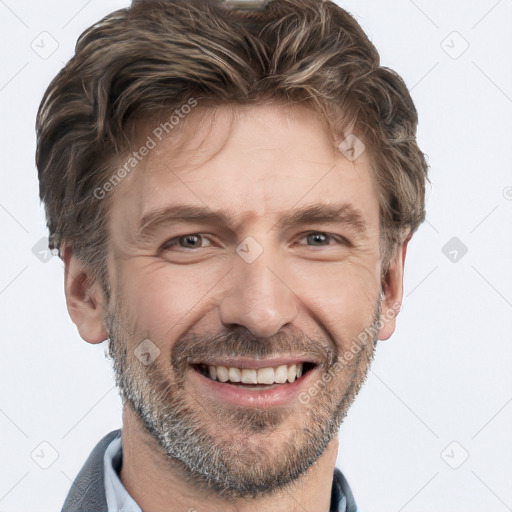 Joyful white adult male with short  brown hair and grey eyes