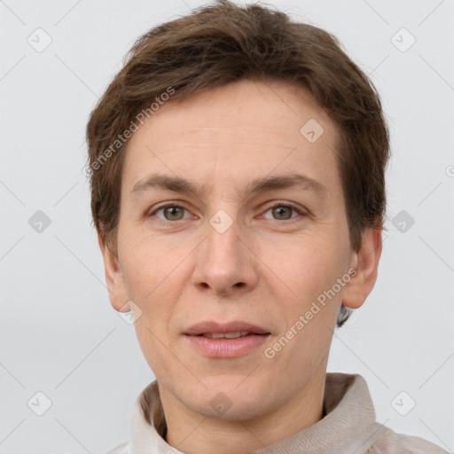 Joyful white adult male with short  brown hair and grey eyes