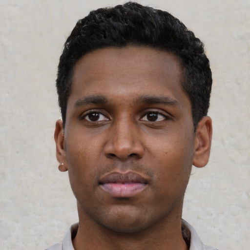 Neutral black young-adult male with short  black hair and brown eyes