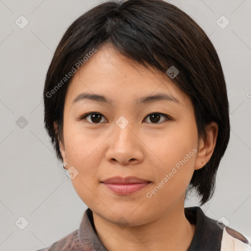 Joyful asian young-adult female with medium  brown hair and brown eyes