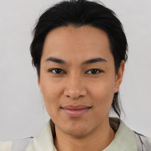 Joyful asian young-adult female with medium  black hair and brown eyes