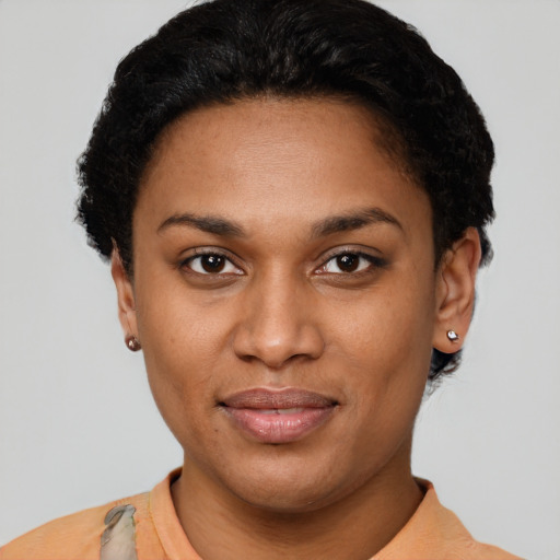 Joyful latino young-adult female with short  brown hair and brown eyes