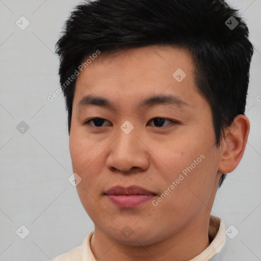 Joyful asian young-adult male with short  black hair and brown eyes