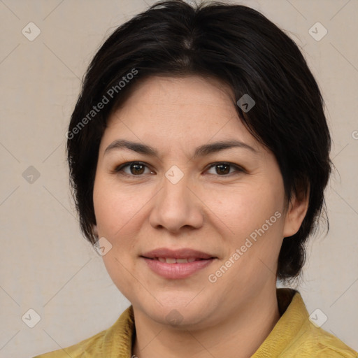 Joyful asian adult female with medium  brown hair and brown eyes