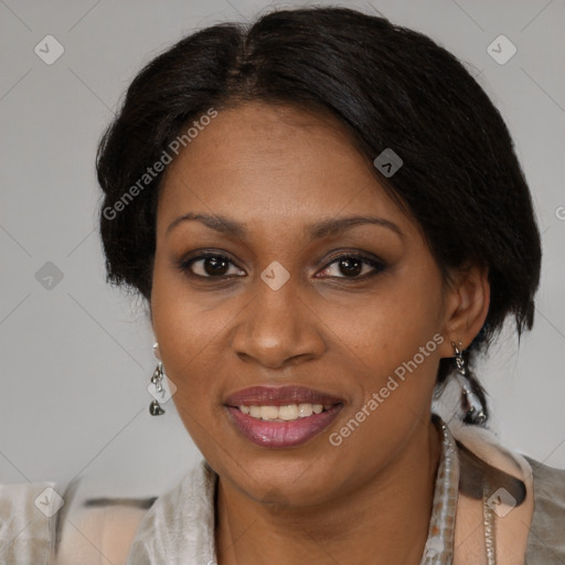 Joyful black adult female with medium  brown hair and brown eyes