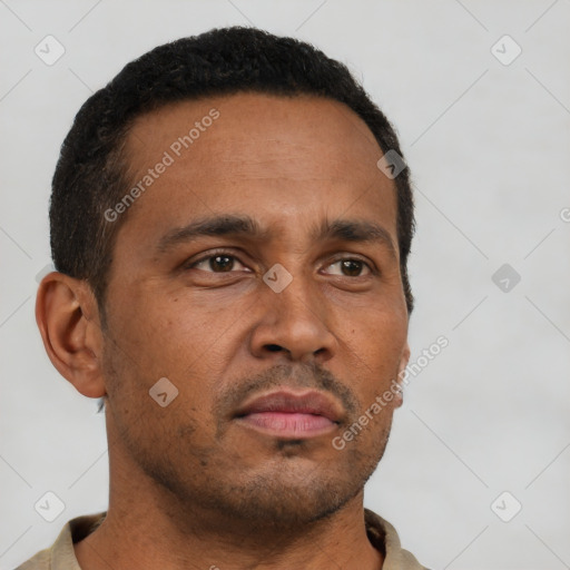 Neutral latino adult male with short  brown hair and brown eyes