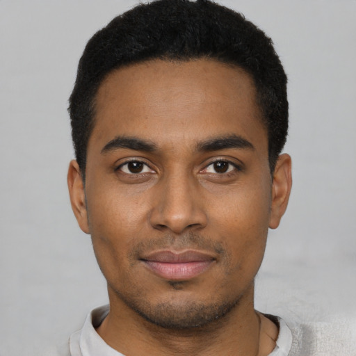 Neutral black young-adult male with short  black hair and brown eyes