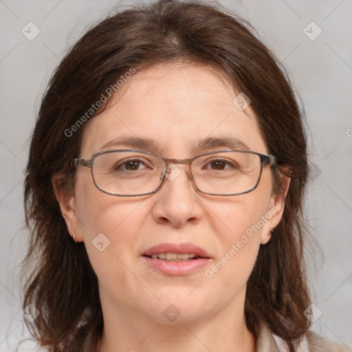 Joyful white adult female with medium  brown hair and grey eyes