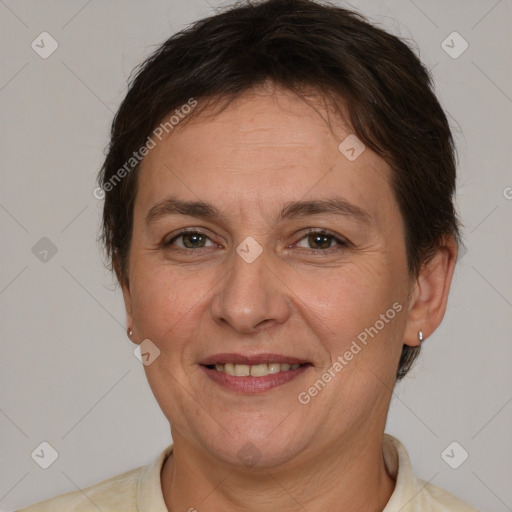 Joyful white adult female with short  brown hair and brown eyes