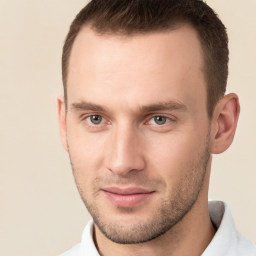 Joyful white young-adult male with short  brown hair and brown eyes