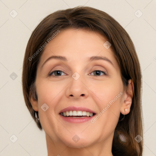 Joyful white adult female with medium  brown hair and brown eyes