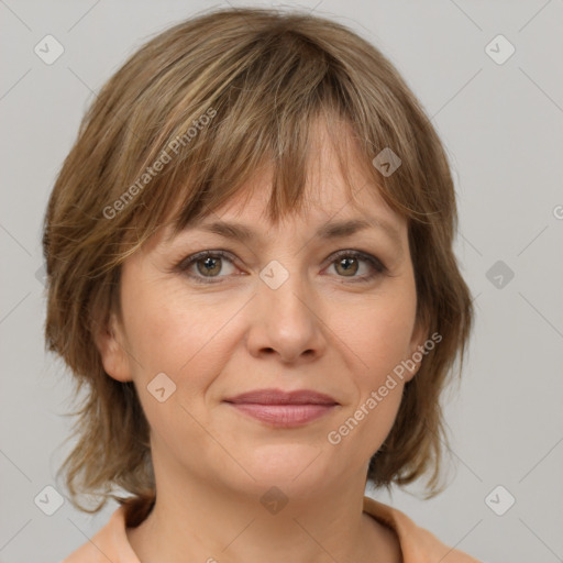 Joyful white adult female with medium  brown hair and grey eyes