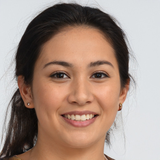 Joyful white young-adult female with medium  brown hair and brown eyes