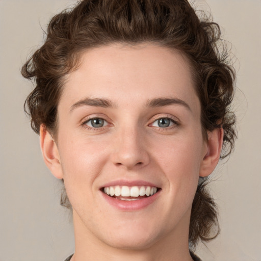 Joyful white young-adult female with medium  brown hair and green eyes