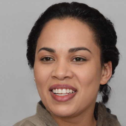 Joyful asian young-adult female with medium  black hair and brown eyes