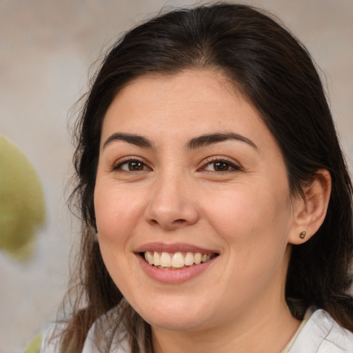 Joyful white young-adult female with medium  brown hair and brown eyes