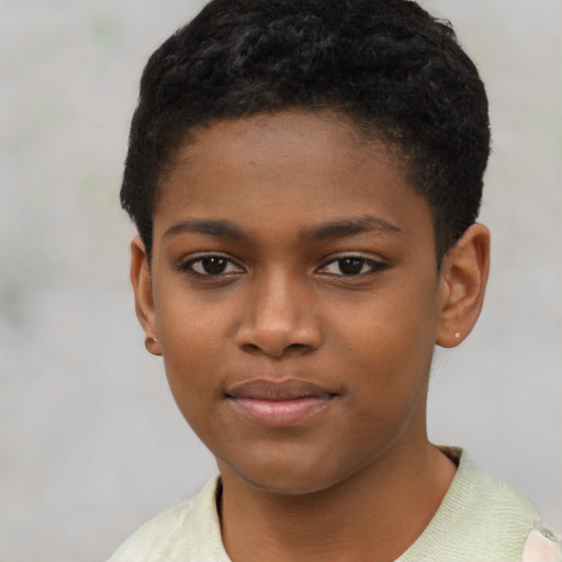 Joyful black child female with short  black hair and brown eyes