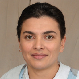 Joyful white young-adult female with short  brown hair and brown eyes