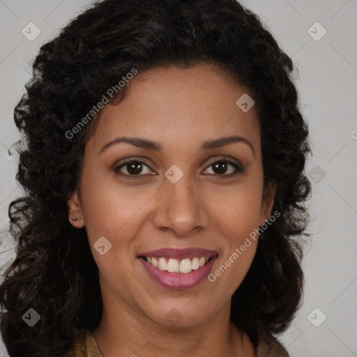 Joyful black young-adult female with long  brown hair and brown eyes