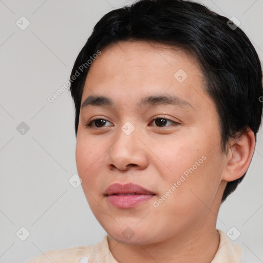 Joyful asian young-adult male with short  black hair and brown eyes