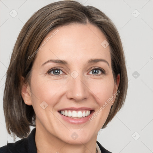 Joyful white young-adult female with medium  brown hair and grey eyes