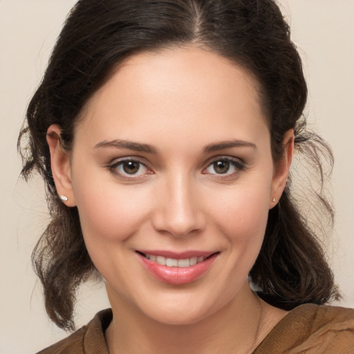 Joyful white young-adult female with medium  brown hair and brown eyes