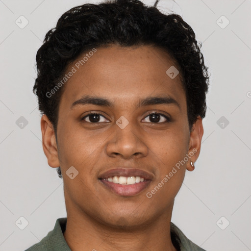 Joyful black young-adult male with short  black hair and brown eyes