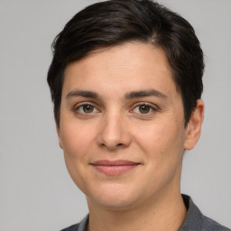 Joyful white young-adult female with short  brown hair and grey eyes